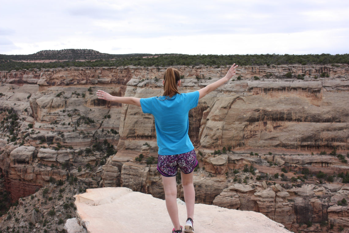 living on the edge, cliff, Colorado National Monument, Colorado, travel blogger