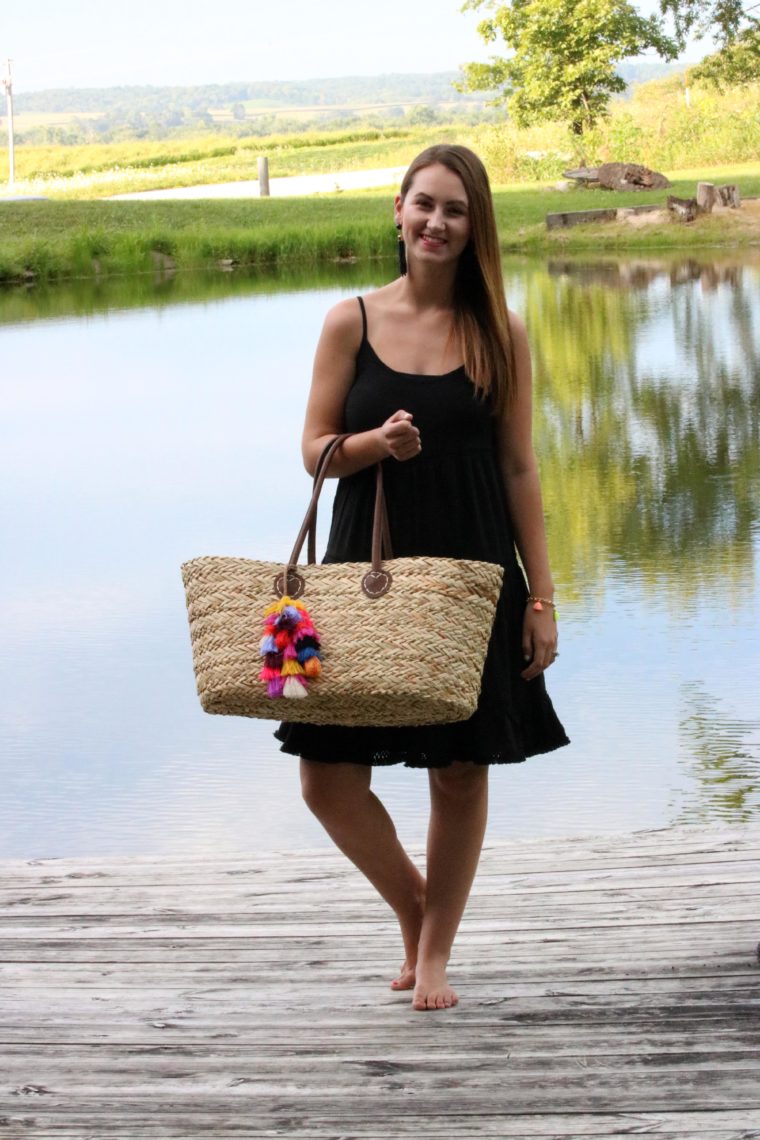 little black dress, tassel tote, blonde hair