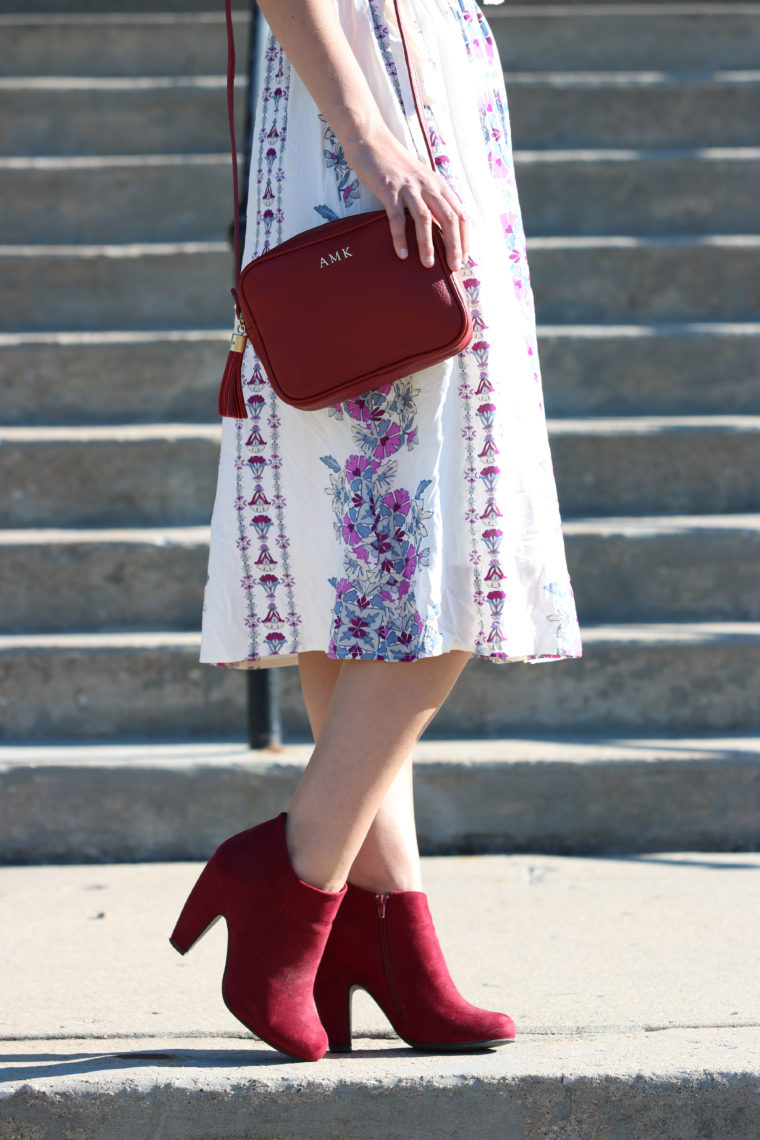 maroon booties, pattern dress, tassel bag