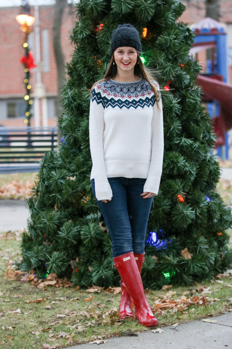 embellished sweater, holiday look, hunter boots, beanie