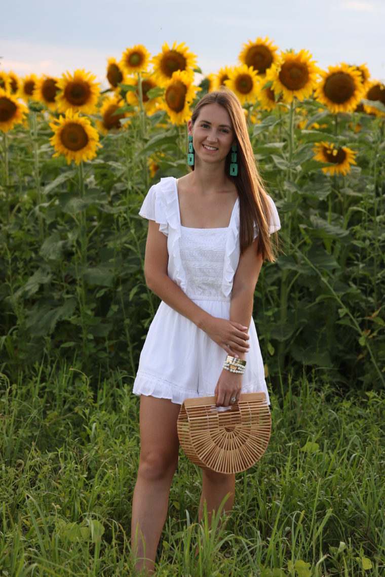 white ruffle romper, Cult Gaia bag, sunflower field