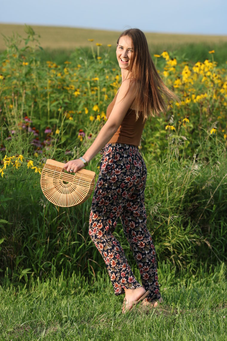 floral jogger pants, Cult Gaia bag, wildflower field