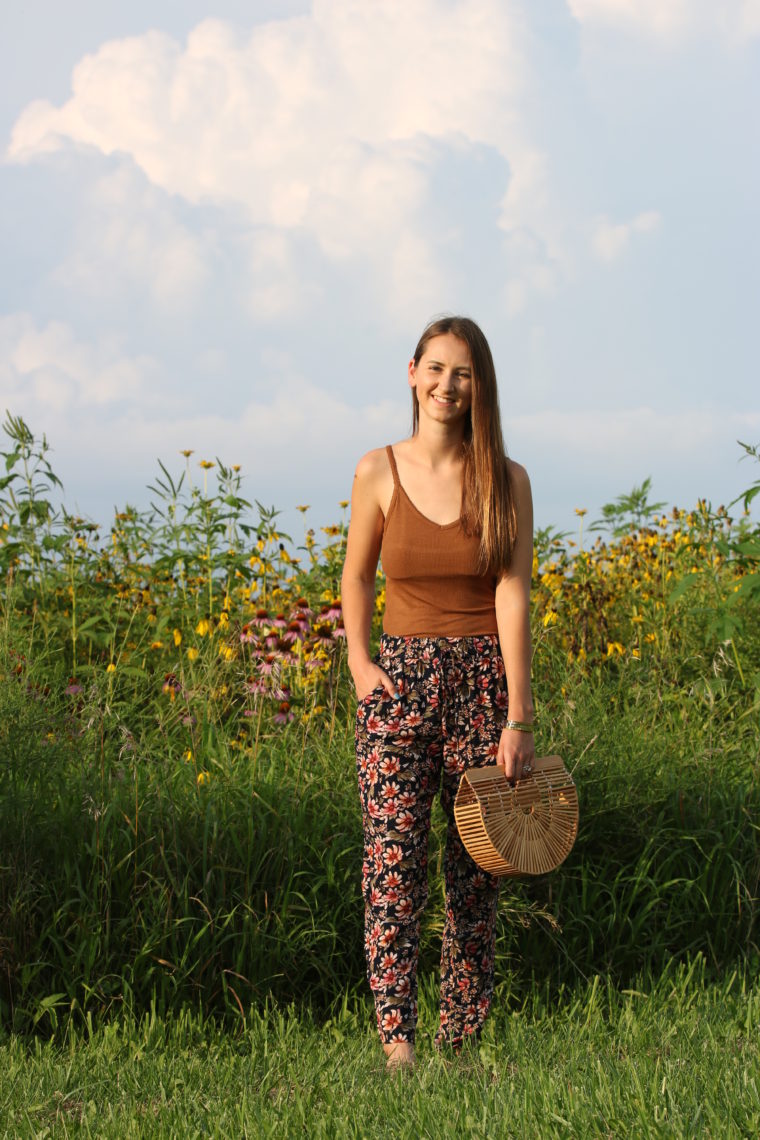 floral jogger pants, Cult Gaia bag, wildflower field