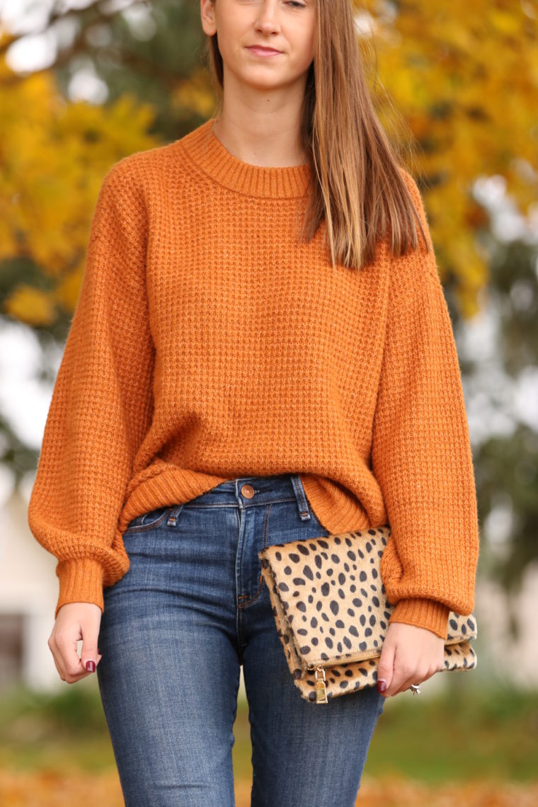 orange sweater. leopard clutch, fall style