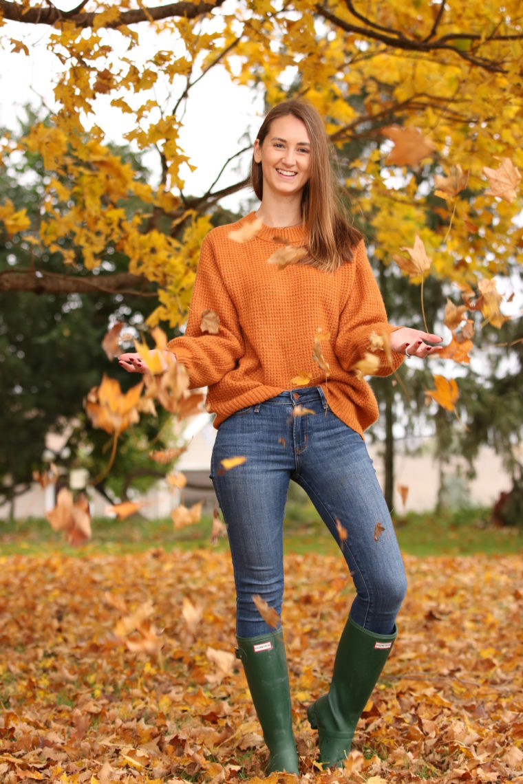 orange sweater, green hunter boots, yellow leaves