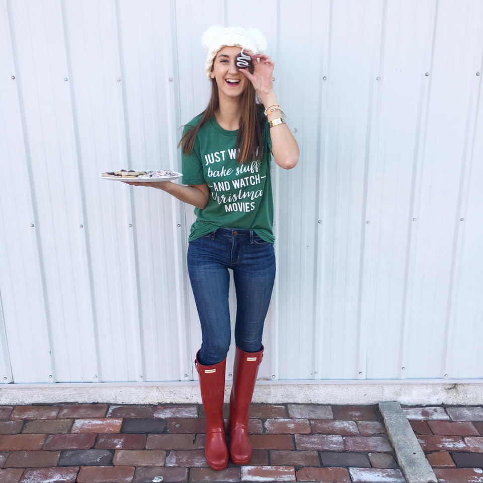 Christmas graphic tee, red Hunter boots, pom pom beanie 