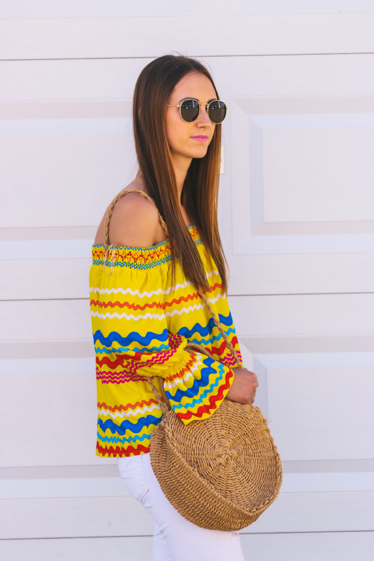 off the shoulder top, round straw bag, round sunglasses