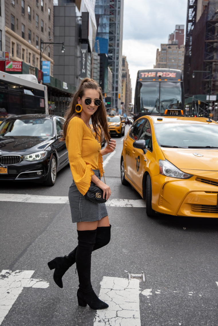 yellow bell sleeve top, houndstooth skirt, NYFW