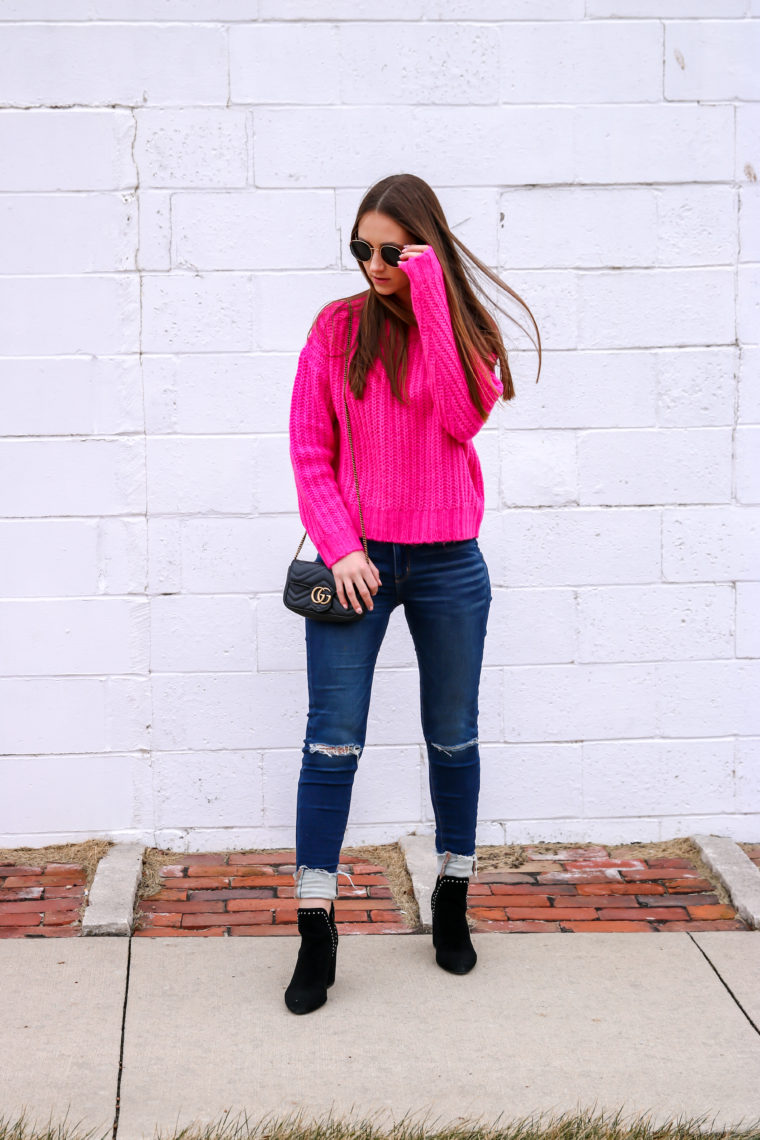 neon pink sweater, black booties, Gucci bag 