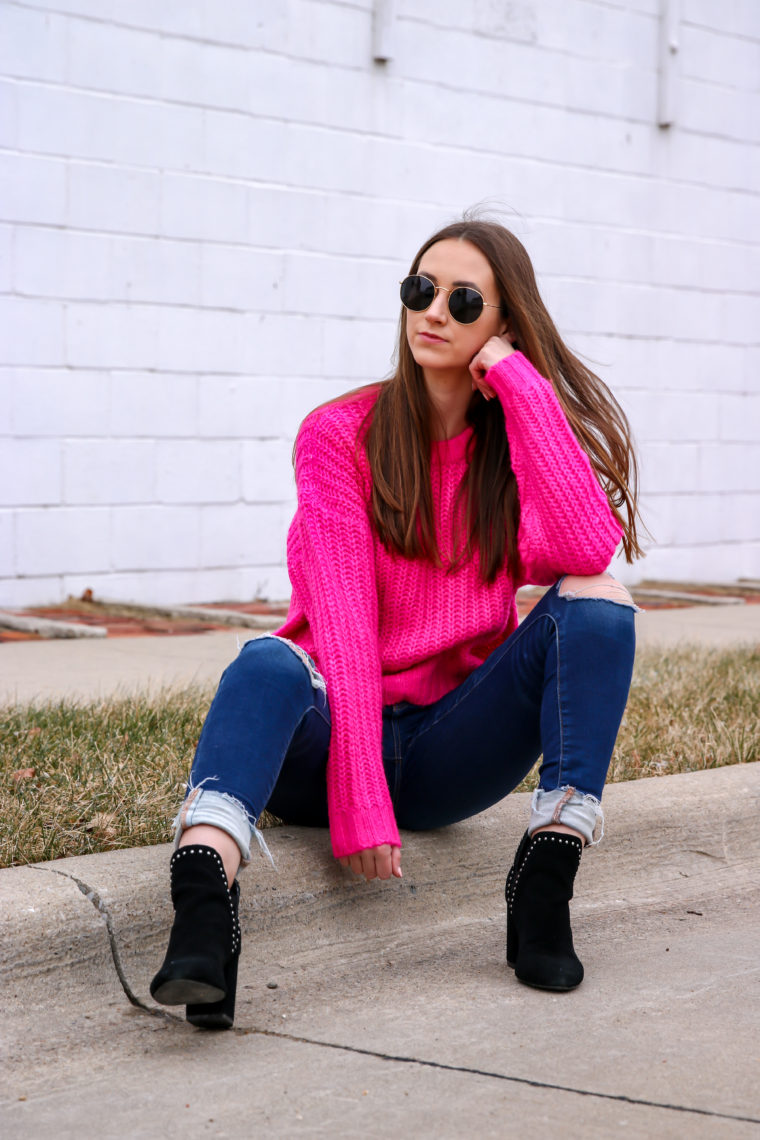 black booties, round sunglasses, hot pink sweater