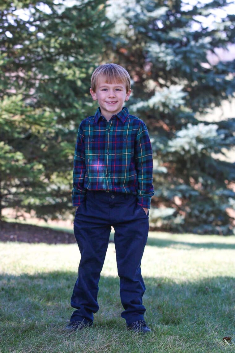 Boy wearing plaid shirt