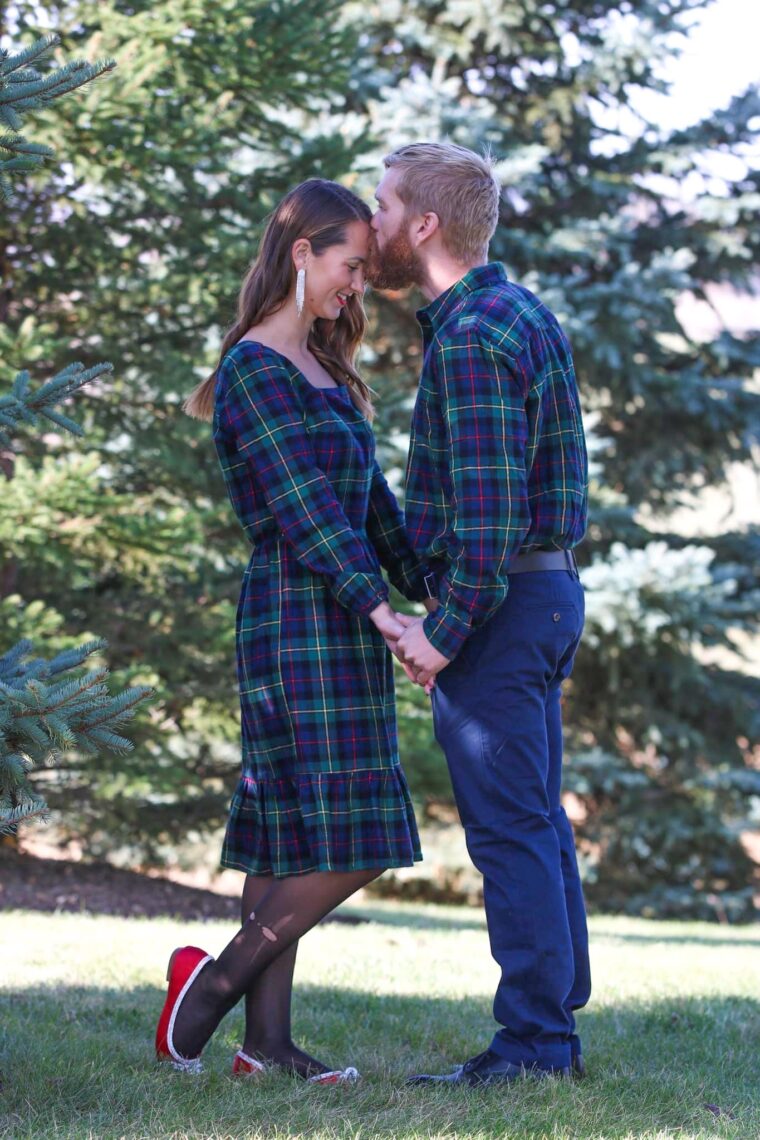 Husband kissing wife on forehead