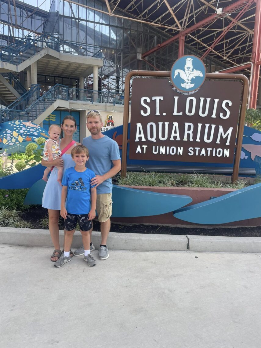 Family standing in front St. Louis Aquarium 