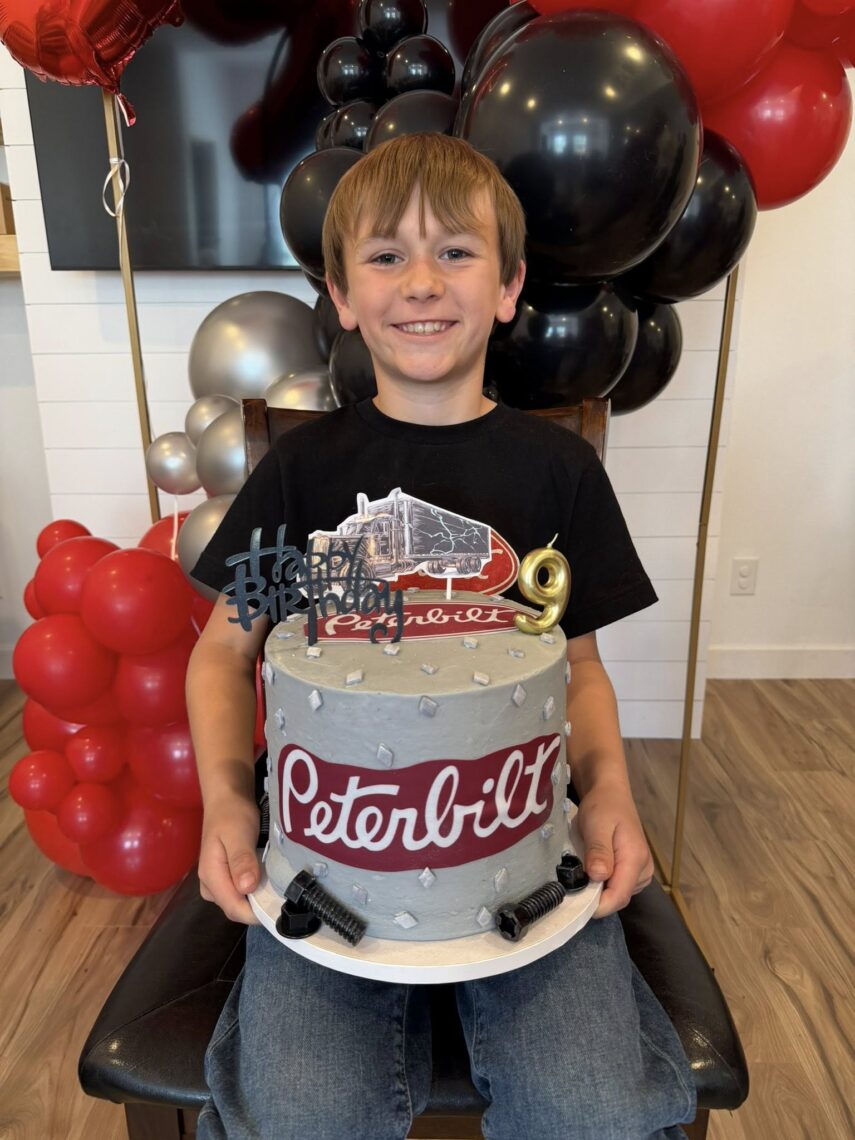 son holding is peterbilt birthday cake